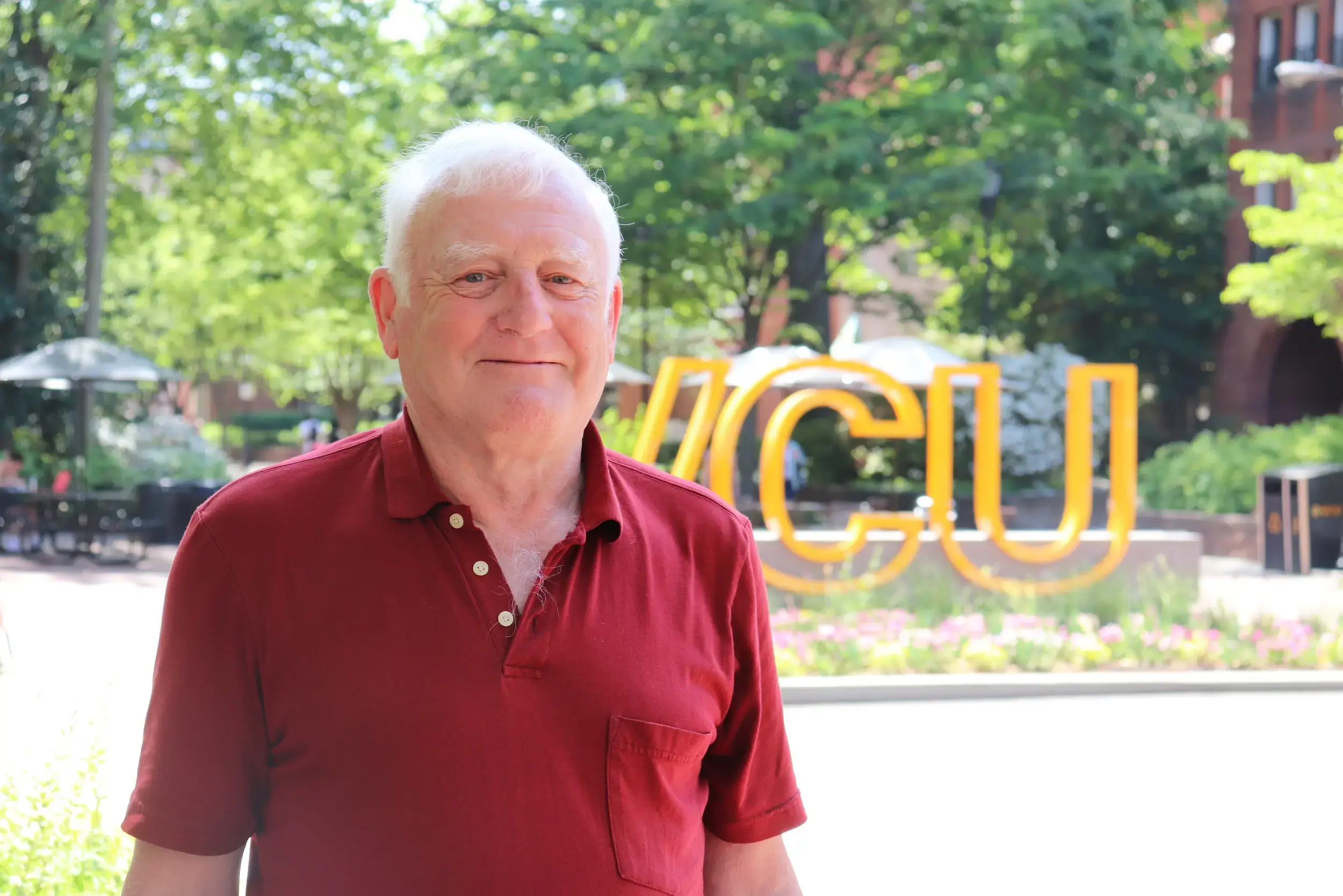 Nick Farrell in front of VCU sign